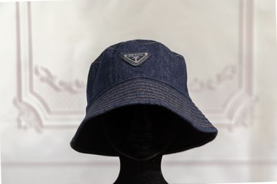 a mannequin head wearing a hat with a triangle on it