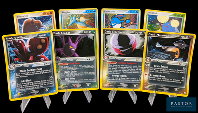Plusieurs cartes Pokémon sont alignées les unes à côté des autres sur un fond noir.