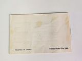 an old piece of paper sitting on top of a white table