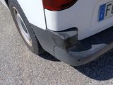a white van parked on the side of the road