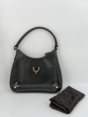 black leather handbag with gold hardware and matching wallet