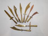 several different types of knives are arranged on a white surface