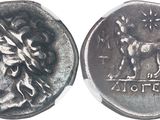 a close up of a silver coin with a horse on it