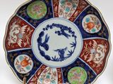 a plate that has a picture of a bird on it