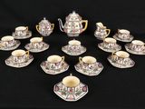 a close up of a group of cups and saucers on a table