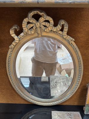 a man taking a picture of himself in a mirror