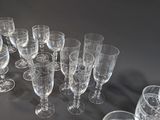 a lot of empty wine glasses on a table