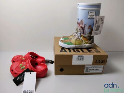 a cup of coffee and a pair of shoes on a table