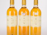 three bottles of wine sitting next to each other on a table