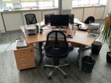 a desk with a chair and a computer on it