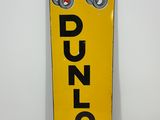 a close up of a yellow sign with a red car on it