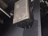 a speaker that is hanging from the ceiling in the room