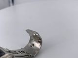 a pair of pliers that are on a white table
