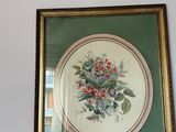 a picture of a picture of flowers on a mantle