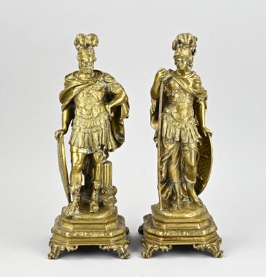 pair of antique bronze figurines of men with shield and shield