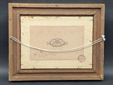 an old picture of a picture frame with a rope around it