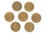 six british gold sovereigns on a white background