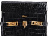 an image of a black purse with gold hardware on it