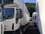many trucks that are parked in a parking lot
