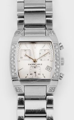 un gros plan d'une montre posée sur une surface blanche, sertie de diamants