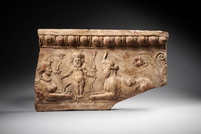 a roman marble relief of a man and a woman on horseback