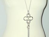 a close up of a mannequin torso with a necklace on it