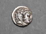 a close up of a silver coin with a woman ' s face on it