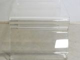 a clear plastic box with a lid on the floor