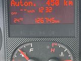 a close up of a car ' s dashboard with a speedometer