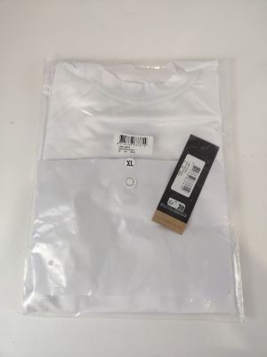 a plastic bag with a white t - shirt on top of it