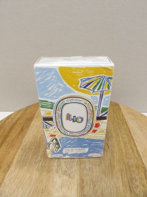 a box of oil sitting on a wooden table
