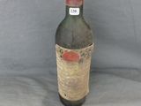 a bottle of wine that is sitting on a table