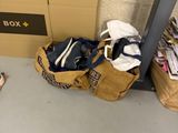 a bag and a pair of shoes sitting on the floor