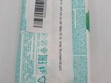 a bag of soap sitting on a white surface