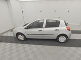 a picture of a small white car parked in a garage