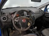 a dashboard of a small car with a steering wheel