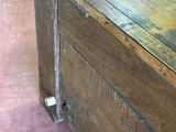 a wooden box that has a flower in it