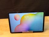 an image of a tablet computer sitting on top of a wooden table