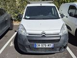 a white van parked in a parking lot next to other cars