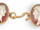 pair of gold - plated and red glass cameos of a man and a woman