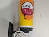 une image représentant une bouteille de bière hollandaise à côté d'un cordon