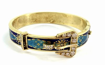 a close up of a bracelet with a buckle on it