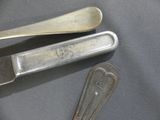 two spoons and a spoon rest on a table