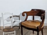 two chairs sitting next to each other on a tiled floor