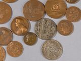 a lot of coins that are laying on a table