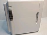 a white air purifier sitting on a white surface
