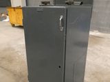 a metal cabinet in the middle of a room