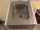 a stainless steel sink with a faucet on the side of it