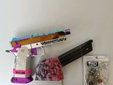 a picture of a toy gun and some other items