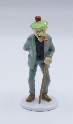 a figurine of a man with a hat and a cane